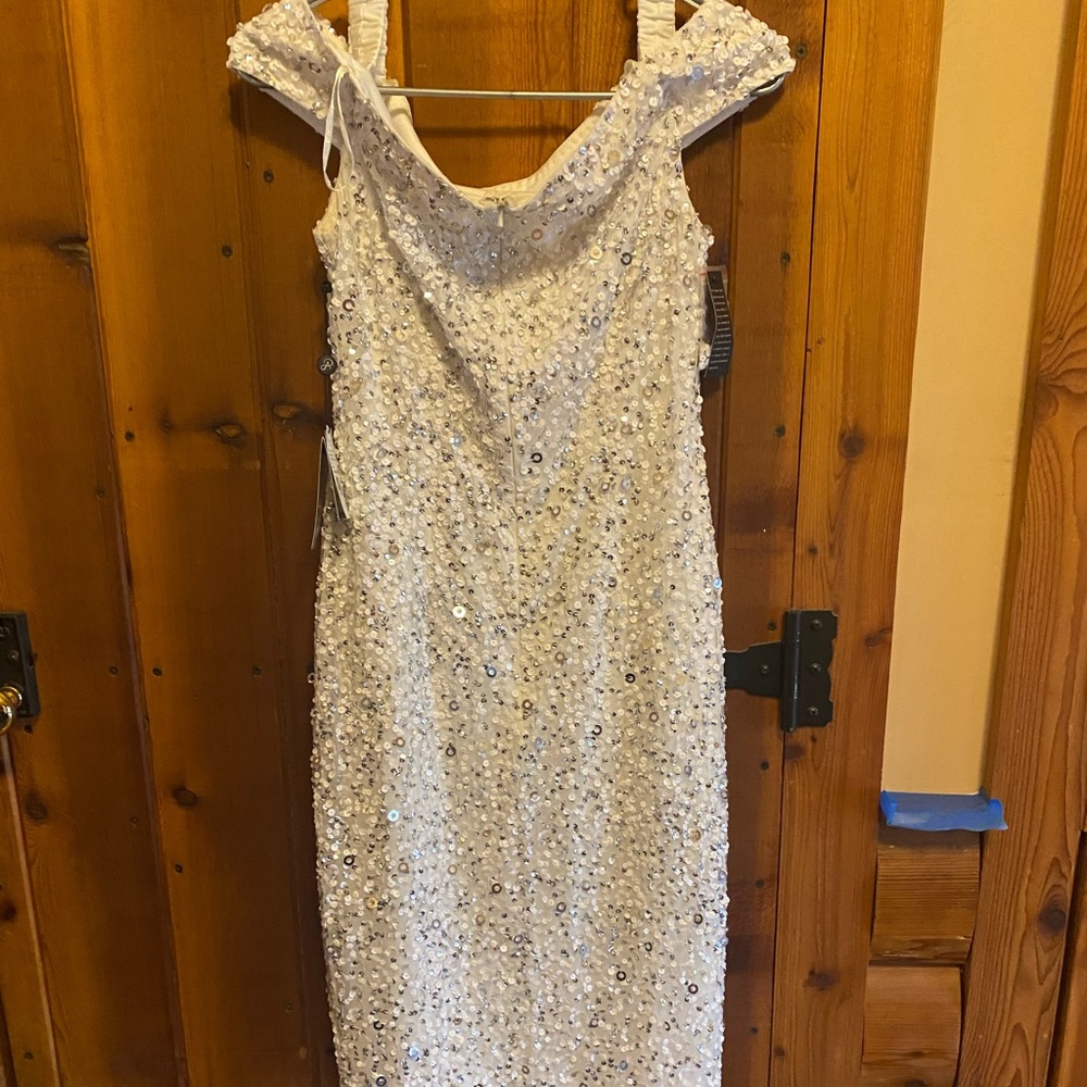 Beautiful off the shoulder dress. New with tags. Would be a great wedding dress